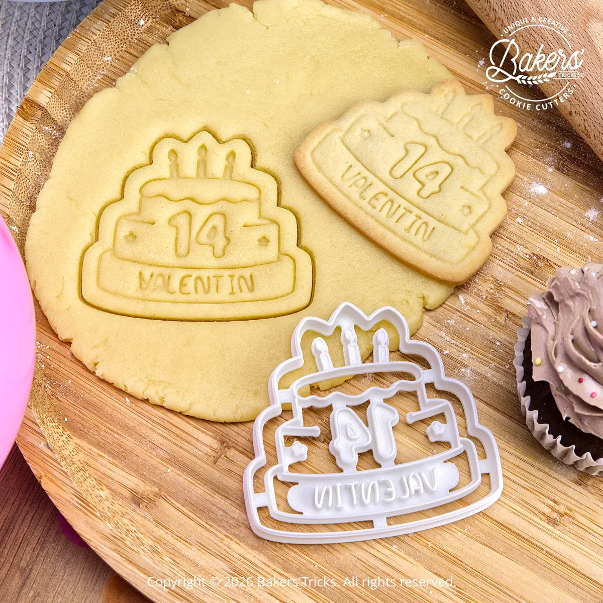 Personalized birthday cake cookie cutter with custom name and age, shown with cut-out cookie dough before baking and the finished cake-shaped birthday cookie with candles.